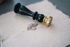 Close-up of vintage sealing wax and stamp on an old-fashioned envelope.